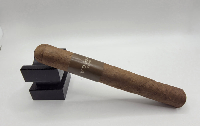 Cigar with a visible brand name on a white background - WD - Honey - Corona