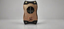 A rose gold cigar cutter with a textured pattern and the Colibri logo on the front.

