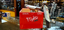 A red box of Maduro Gordo cigars with the brand name 'Psyko' displayed on it. A single cigar is visible, resting on top of the box.