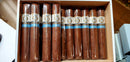 A box of Alec Bradley Project 40 Natural Gordo cigars, displaying multiple wrapped cigars with brand labels.
