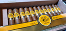 A box of Quai D'orsay cigars, displaying multiple cigars with gold and yellow branding, arranged in a neat pattern inside a wooden humidor.

