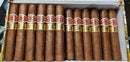A box of Romeo y Julieta Short Churchill cigars displayed neatly with their bands and tips facing upwards